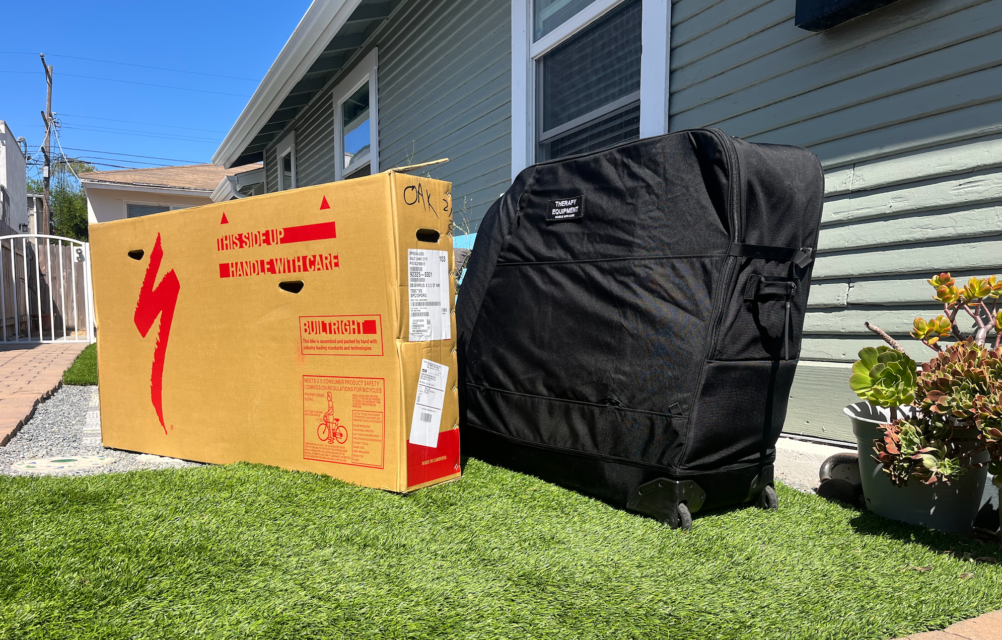 Two bike travel packing methods: cardboard box and compact travel case shown side-by-side
