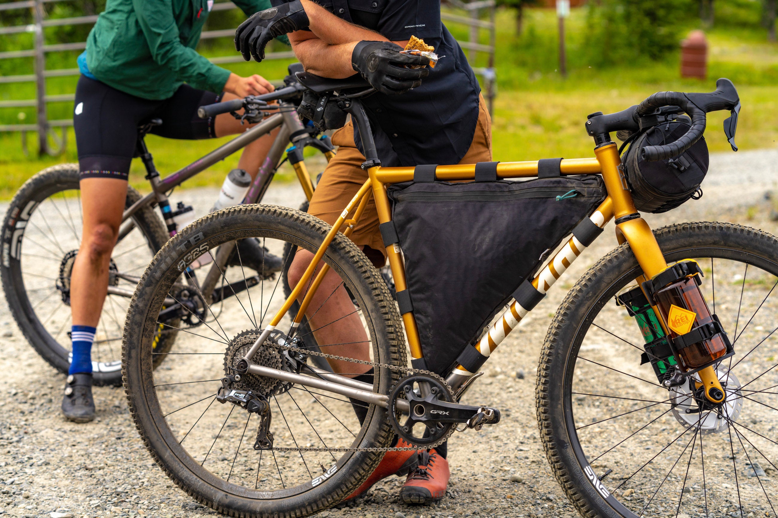 Off-road cyclist with a custom frame bag and Orucase Smuggler XL bag. 