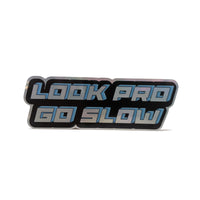"Look pro / go slow" sticker in shadowed chrome letters with black outline